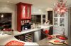 Red cabinets add pops of color and style to this kitchen