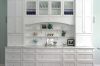 Custom white cabinetry with glass insets