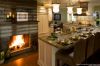 Warm kitchen with beautiful cabinetry and fireplace